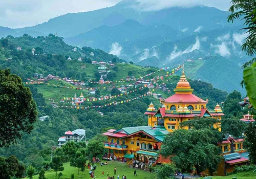 Colourful monastery above green hills in Darjeeling and Sikkim
