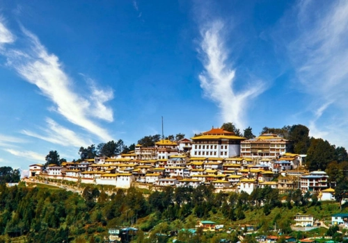 Tawang Monastery on a hillside in Arunachal Pradesh under blue sky